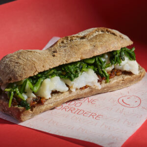 Ciabatta ai semi, baccalà, cicoria ripassata, limone salato e pesto di mandorle e pomodori secchi