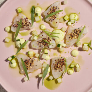 Carpaccio di cernia, melone, cetriolo, maionese al rafano, quinoa soffiata